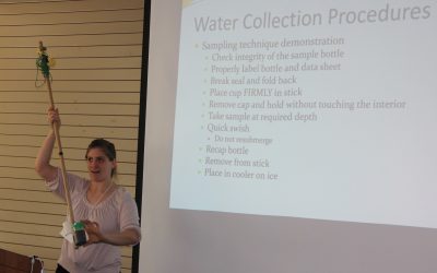 Jenifer Yeadon, environmental analyst with the state Bureau of Aquaculture, gives a water sampling lesson to members of the state's shellfish commissions.