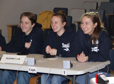 Members of the Plainville High School team share a laugh between rounds.