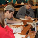 Norwich Free Academy team members compete in the timed short-answer portion of the contest.