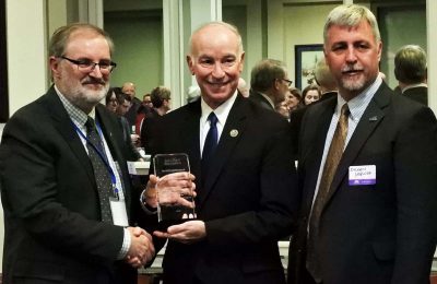 Rep. Joe Courtney, center, receives the Sea Grant Association Special Recognition Award from James Hurley, president of the association and director of Wisconsin Sea Grant. On Courtney's right is Sylvain De Guise, director of Connecticut Sea Grant.