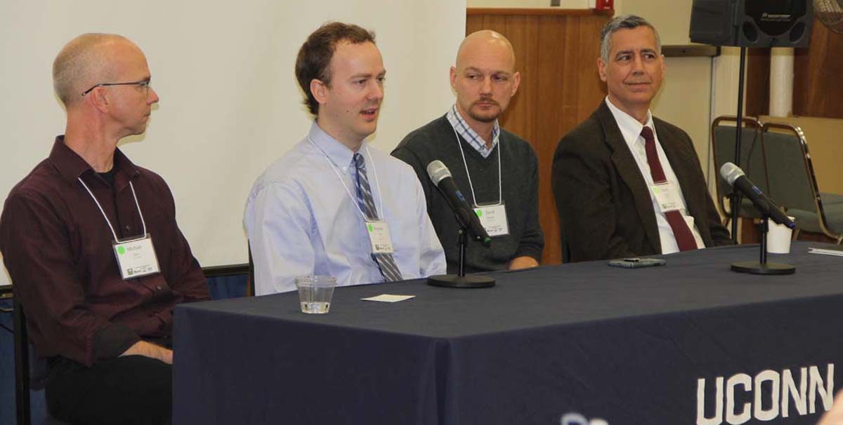 New Haven City Engineer Giovanni Zinn, second from left, answers a question during a panel discussion about low impact development. To his left is Michael Dietz and to his right is David Dickson, both of UConn CLEAR, and at far right is David Sousa of CDM Smith.