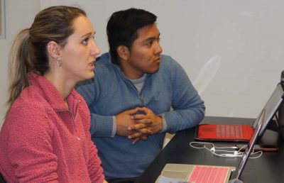 Adelaine McCloe and Tony Arreaga, describe their project for towns with neighborhoods of beaches, marinas and waterfront homes during the March 29 class at the UConn campus in Storrs.