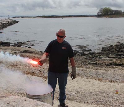 Ted Williams, marine safety coordinator with Hercules SLR Inc., shows one of several kinds of emergency flares.