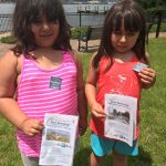 Fort Griswold Quest participants show off the stickers they earned for finding the treasure.