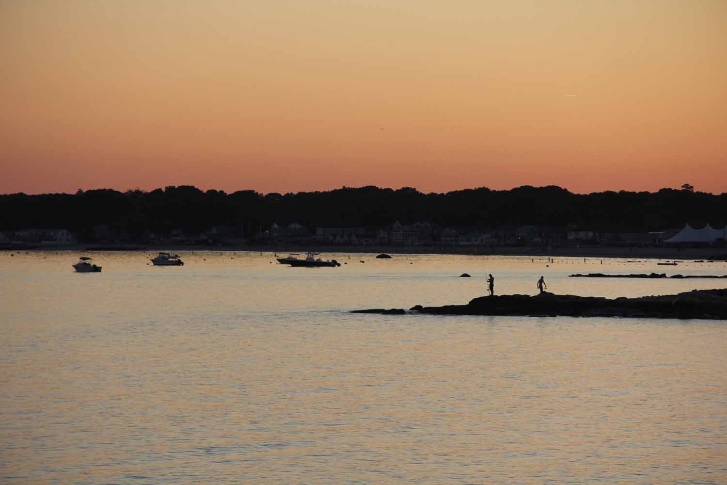 Sunset over Hatchetts Point in Old Lyme as fishermen head in for the night.