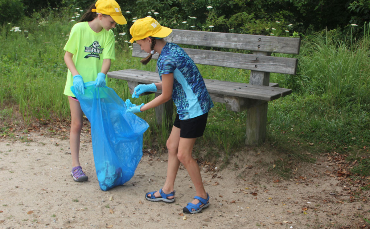 Maya Fisher and Charlotte Preuss collected numerous cigarette butts around a bench at Bluff Point State Park during the cleanup.