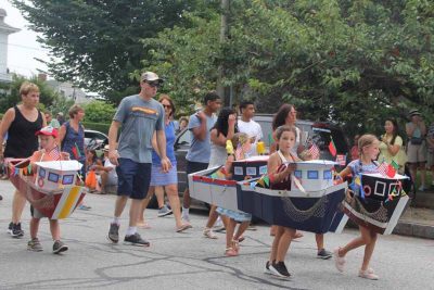 Students in New England Science & Sailing marched in the parade in boat costumes.