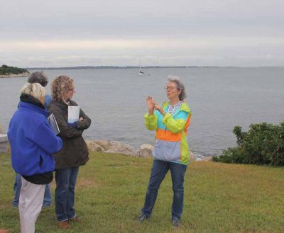 Judy Preston tells members of the painters group about the coastal habitats at Avery Point.