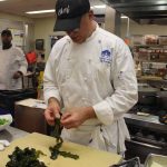 Chef Jeff Trombetta separates leaves of kelp before chopping.