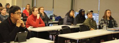 Students in the Climate Corps class listen to one of the presentations about sea level rise impacts.