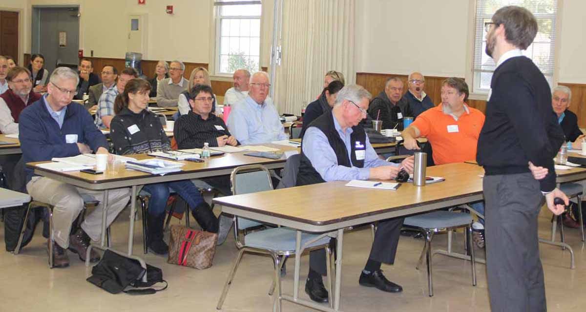 Attorney Read Porter of the Marine Affairs Institute and Rhode Island Sea Grant Legal Program listens to a question from the audience after his presentation about the legal implications of road flooding.