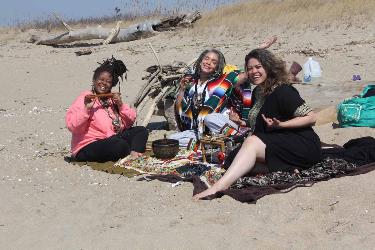 Toni Johnson, right, Azua Echevarria, center, and Andrea Cortez, all of Hartford, enjoyed the first day of spring at Hammonassett on March 20 as the release of the first Long Island Sound Blue Plan was announced.