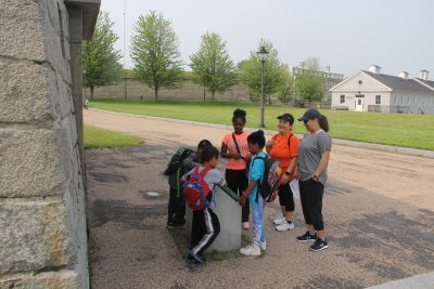 Maria Cruz, second from right, and her family start the Fort Trumbull Quest at the Blockhouse.
