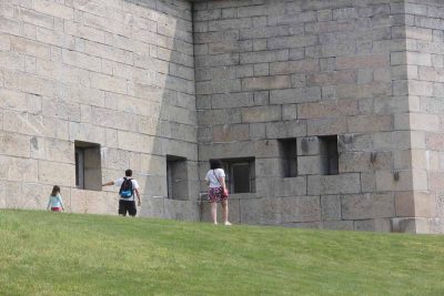 A family searches for clues at Fort Trumbull during the Thames River Quest.