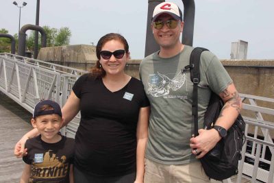 Christopher Murphy, left, and his parents Vanessa and Scott Murphy wore their stickers after completing the Fort Trumbull Quest.