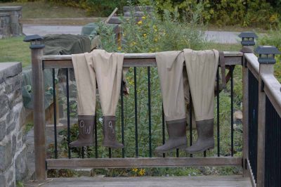 Two pairs of waders dry in the sun outside the Norrie Point center.