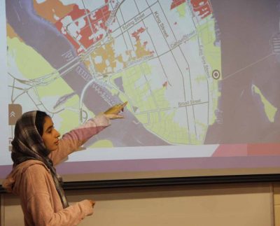 Nissrine Essafi, a student in the Climate Corps class, shows a map of Charleston, S.C., during a presentation on Dec. 6 of a project about sea level rise impacts.