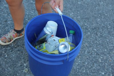 One of the volunteer's buckets is filled with bottles, cans and Styrofoam cups about 90 minutes into the cleanup.