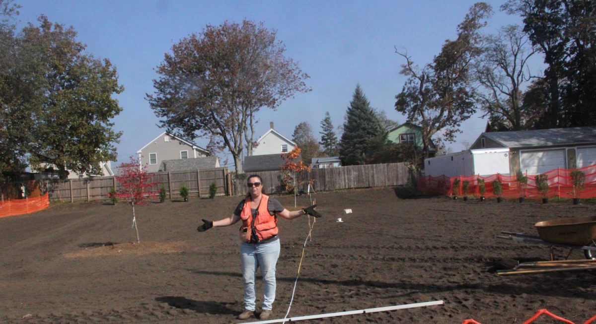 Kristin Walker, project engineer for the USDA’s Natural Resource Conservation Service, explains how the former home site is now being planted with native species to create a flood plain habitat.