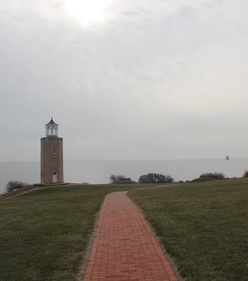 The Avery Point lighthouse looks out over Long Island Sound and Ledge Light at the mouth of the Thames River.