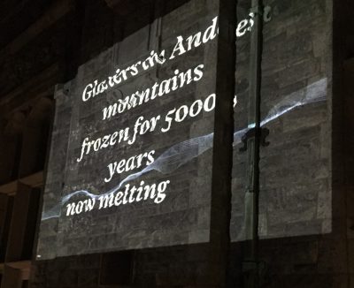 Image of a "Reading the Wrack Lines" digital audio/video projection on the Branford House at UConn Avery Point.