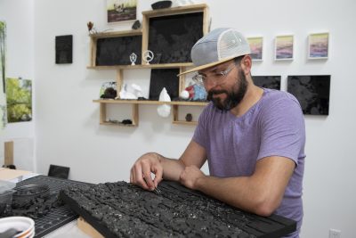 Joseph Smolinski works on a sea coal mosaic in his New Haven studio.