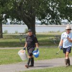 Marc Montillier, left, and Jean-Pierre Montillier of Westport, members of the Y’s Men, collected most of the trash they collected from the jetties.