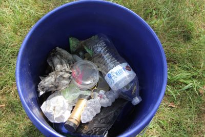 The bucket of trash collected by the Mehta family included empty cognac and wine bottles and many plastic food wrappers.