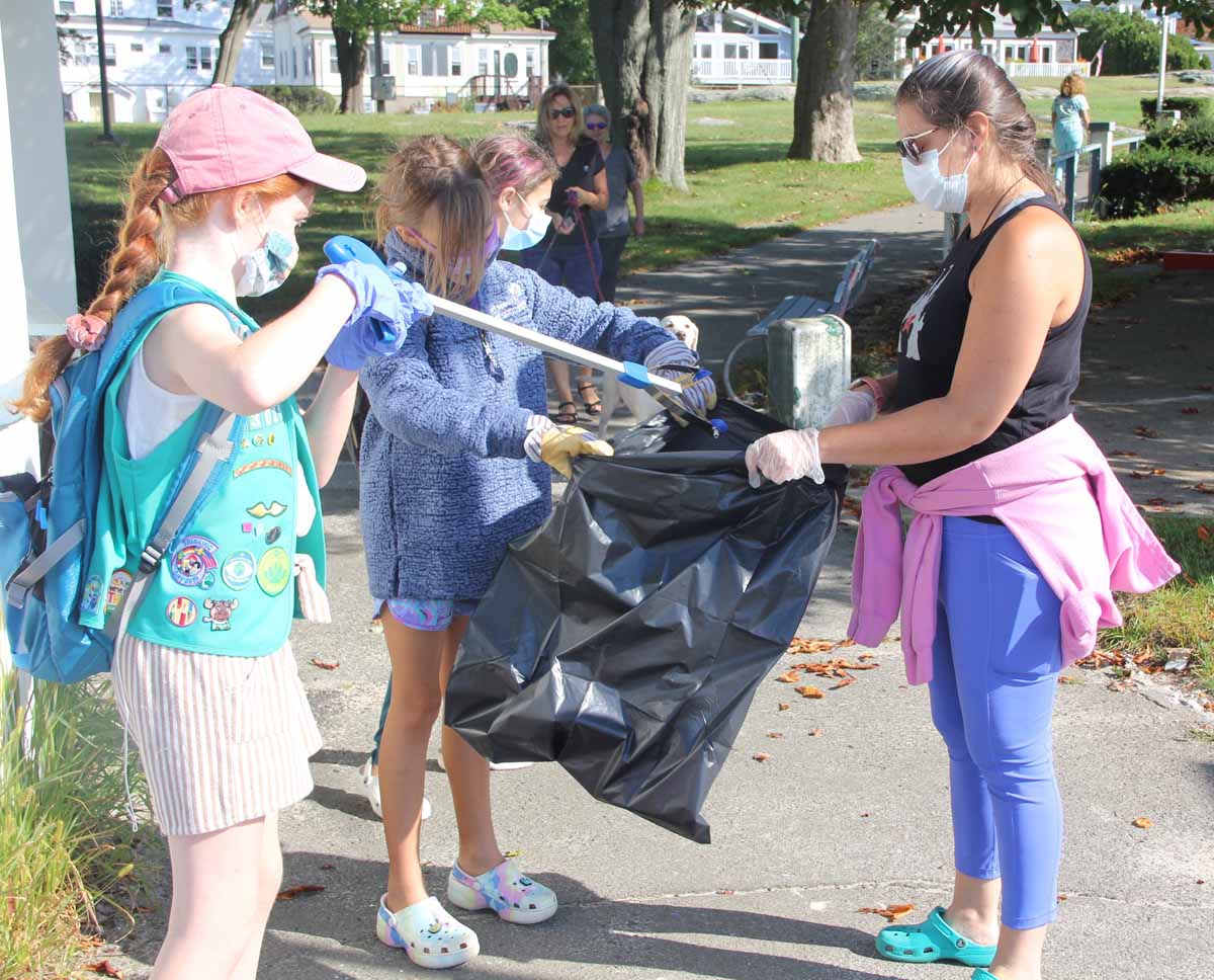 Cheryl Kydd of New London, right, was one of the leaders of the New London Girl Scout troop that volunteered at the cleanup.