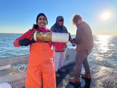 Anoushka Concepcion holds a kelp seed spool before helping farmers deploy it at a site in Long Island Sound in 2022