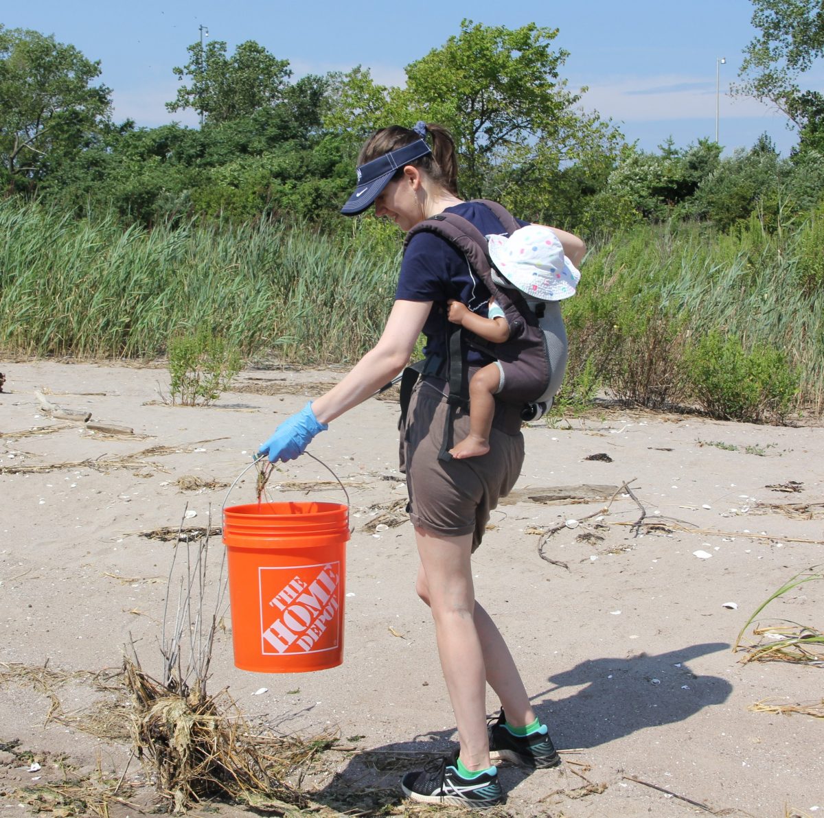 Deb Abibou, CT Sea Grant assistant extension educator-sustainable and resilient communities, joined in the cleanup with her 10-month-ol son in tow.