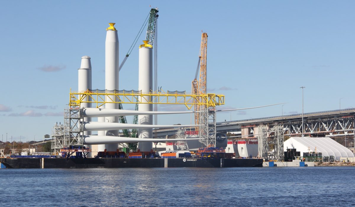 Towers and blades for the South Fork wind farm being built off the Long Island coast are staged and prepared for transport to the site at State Pier in New London on Oct. 31, 2023.