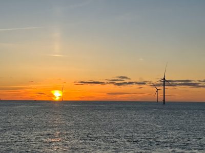 Three of the 12 turbines that will comprise the South Fork wind farm are seen at sunset. Photo courtesy of the Connecticut Port Authority.
