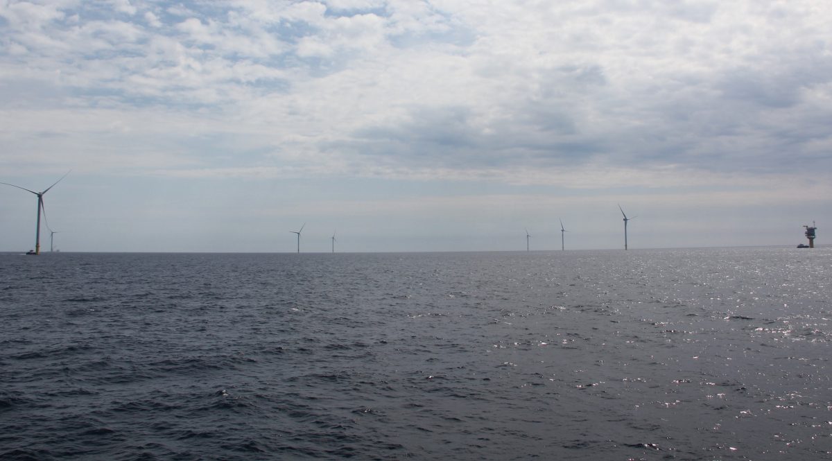 Seven of the 12 turbines that make up the South Fork Wind project are seen from the deck of a ferry boat touring the site on May 14.