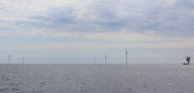 Five of the 12 turbines and the substation of the South Fork Wind project are seen from the deck of a ferry touring the site off Long Island on May 14.