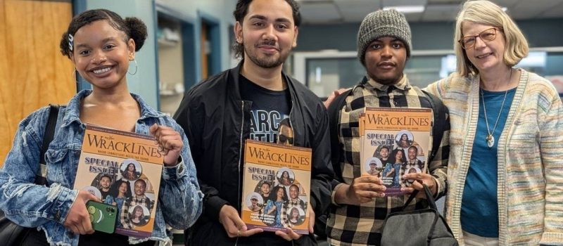 High School in the Community students, from left, Eden Torres, Isaiah Sosa and Dominic Moore met with Judy Benson, Wrack Lines editor, to receive copies of the magazine where their essays about nature and climate change appear.