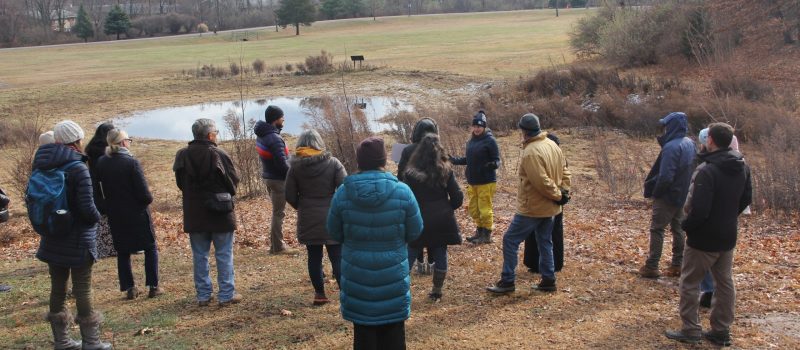 Municipal officials and land trust representatives from CT and NY learn about a rain garden project in Hamden on Dec. 5 as part of the 2024 Annual Sustainable and Resilient Communities Workshop.