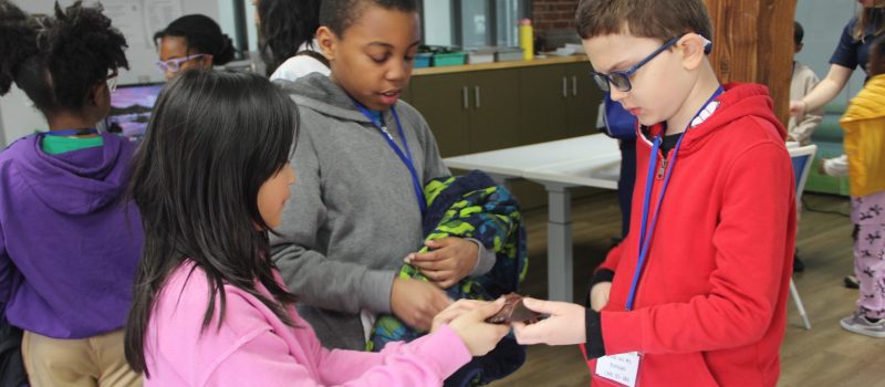 Students in the "Life Between the Tides" activity examine a hermit crab model during the Long Island Sound Schools Network Symposium at The Maritime Aquarium at Norwalk on March. 14.