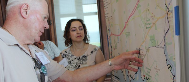 Fran Pijar of the Clean Up Sound and Harbors nonprofit shows Yaprak Onat of CIRCA an area in Stonington prone to flooding during a June 25 workshop for the pilot project launching the MyCoast app in Connecticut to track storm and tidal flooding. CT Sea Grant, the CT NERR and CIRCA are partnering in the project.