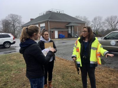 Climate Corps interns, left, meet with a town official to discuss a project.