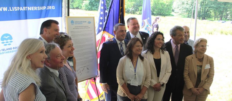 EPA, CT and NY officials and other others flank the resolution they signed on June 20 supporting the new Comprehensive Conservation and Management Plan for Long Island Sound. CT Sea Grant is part of the Long Island Sound Partnership that created the plan.