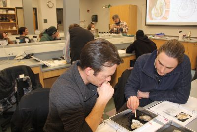 Students in CTSG's "Foundations of Shellfish Farming" class dissect an oyster.