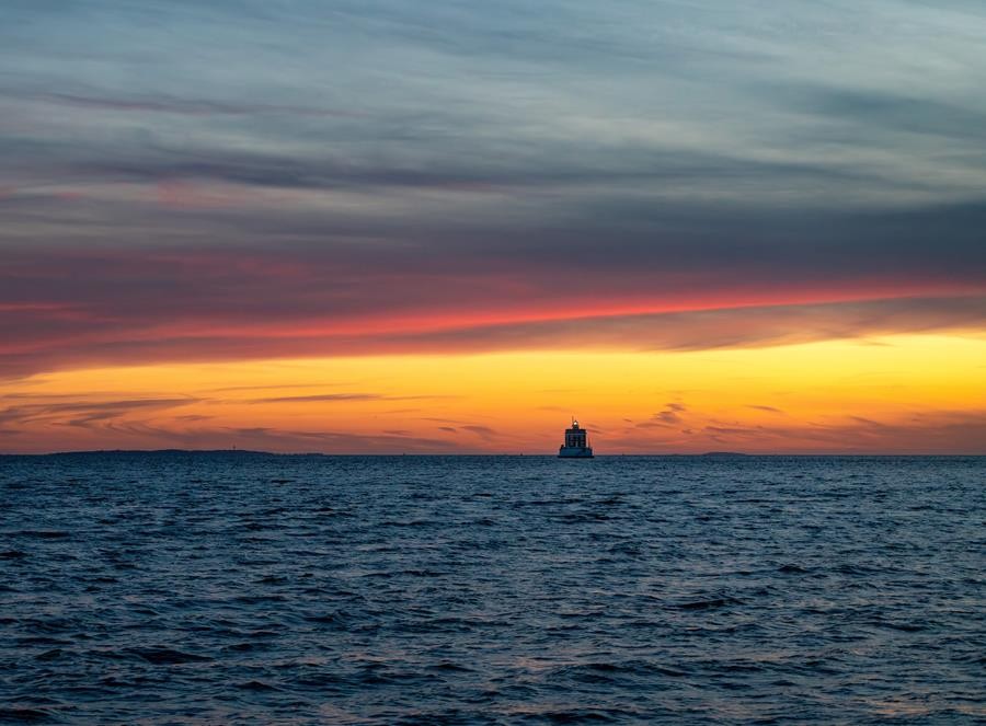 Sunset over Long Island Sound at the mouth of the Thames River overlooking Ledge Light.