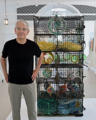 Richard Klein with one of the works in the "Sight and Sound" exhibit titled "Where Have All the Lobsters Gone?"