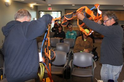 Mark Bisnett, left, and Russell Kingman, both of Fishing Partnership, open an emergency ladder used in man overboard rescues.