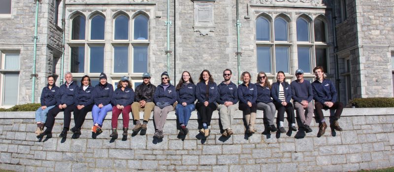 The staff of Connecticut Sea Grant on the porch of the Branford House at the UConn Avery Point campus.