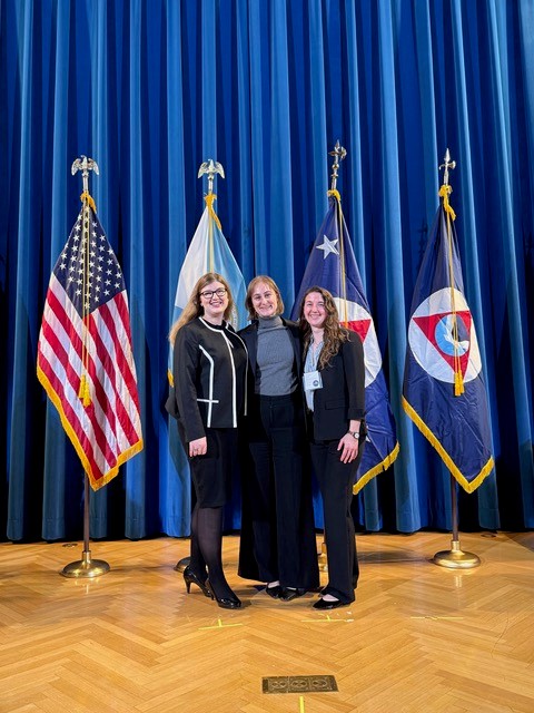 Christy Mueller, Maddy Meadows-McDonnell and Mari Cullerton posed for a photo during the final week of their 2025 National Sea Grant College Program Dean John A. Knauss Marine Policy Fellowship.