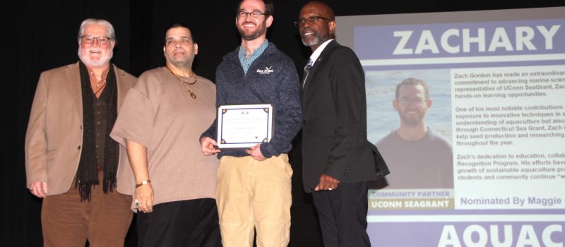 CTSG Assistant Extension Educator Zachary Gordon with school officials after receiving the Superintendent's Recognition Award from Bridgeport Public Schools for his work with the Bridgeport Regional Aquaculture Science and Technology Education school on Feb. 26, 2026