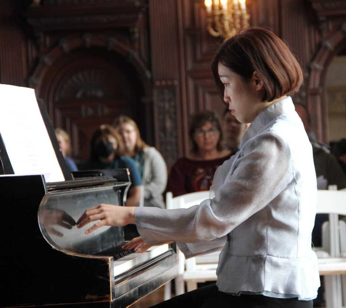 Pianist Hea Youn "Sophy" Chung performs one of the selections from the "Harmony of Nature" project at a 2024 concert at UConn Avery Point. Judy Benson / Connecticut Sea Grant