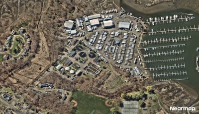 An aerial view of the Branford Water Pollution Control Facility, center, shows its location on the Branford River and a nearby marina.